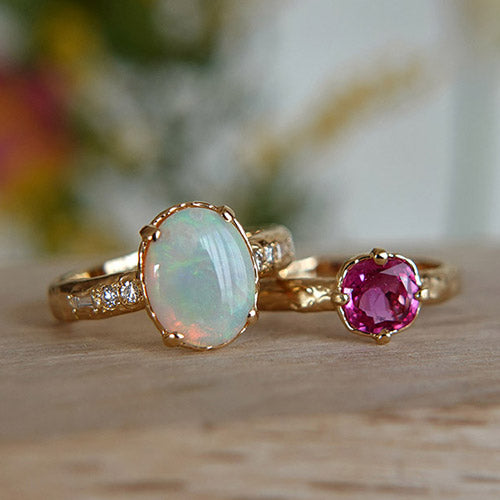 White opal & ruby set rings